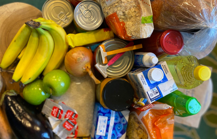 Close up of groceries include fruit, vegetables and pantry goods