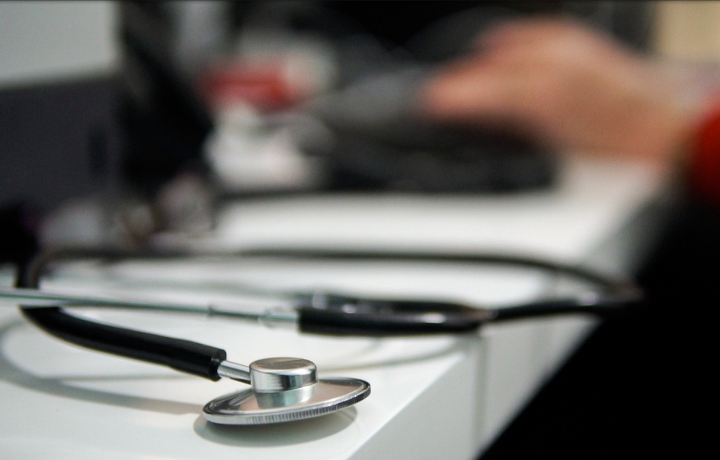 Stethoscope resting on a nurse's desk. Health care