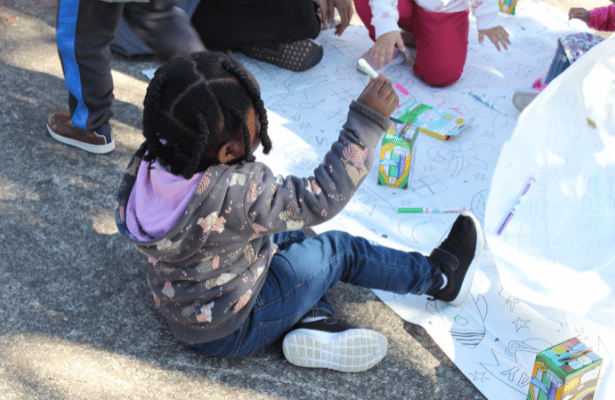 Hope, 2, plays with other children at the ASC Family Day.