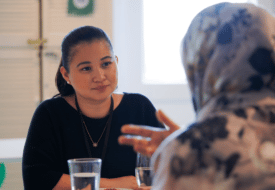 Learn how the ASC is responding to our your feedback. A photo of two women chatting at the ASC office.