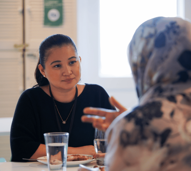 Learn how the ASC is responding to our your feedback. A photo of two women chatting at the ASC office.