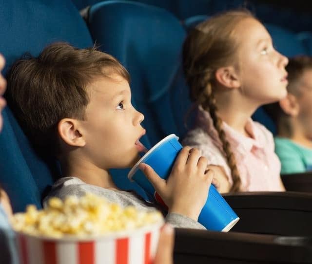 Stock image of children at the cinema