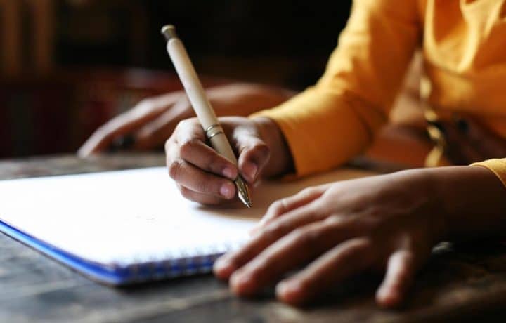 Stock image of a person writing
